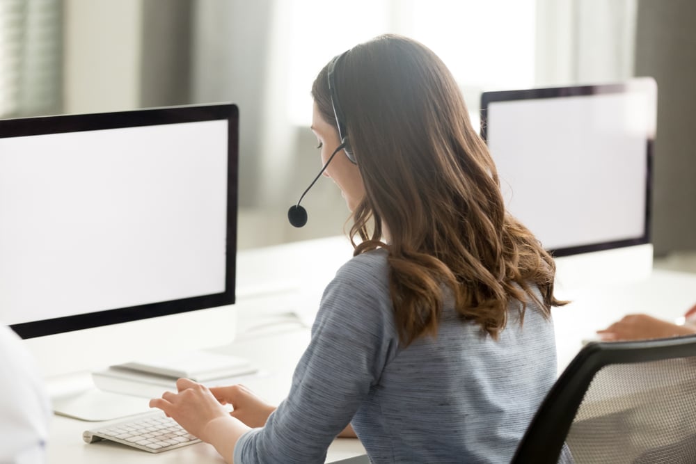 person_with_headset_at_computer_M